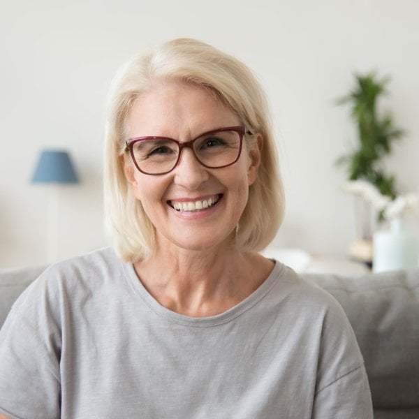 Smiling middle aged mature grey haired woman