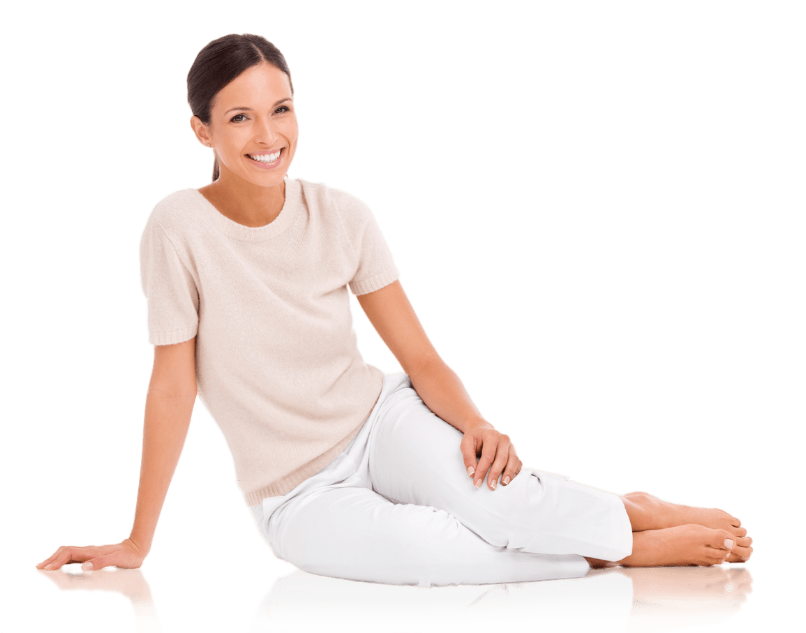 Lady Dressed in White clothes sitting on the floor looking happy